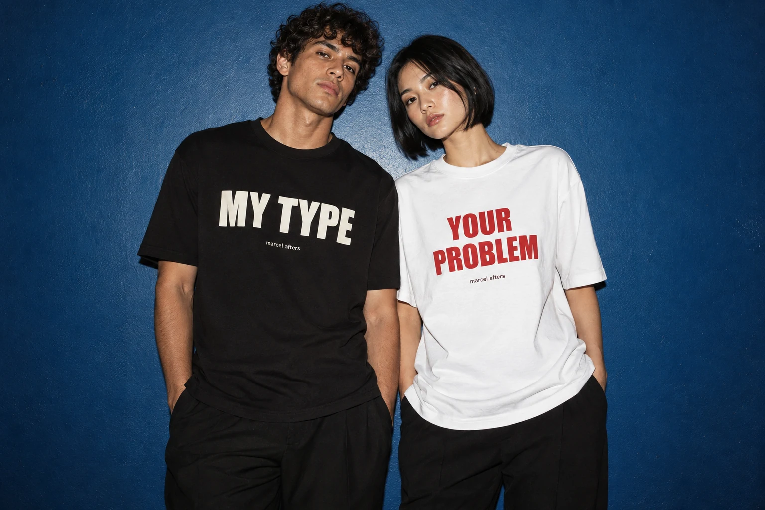 Adult man and woman in Marcel Afters My Type and Your Problem shirts
