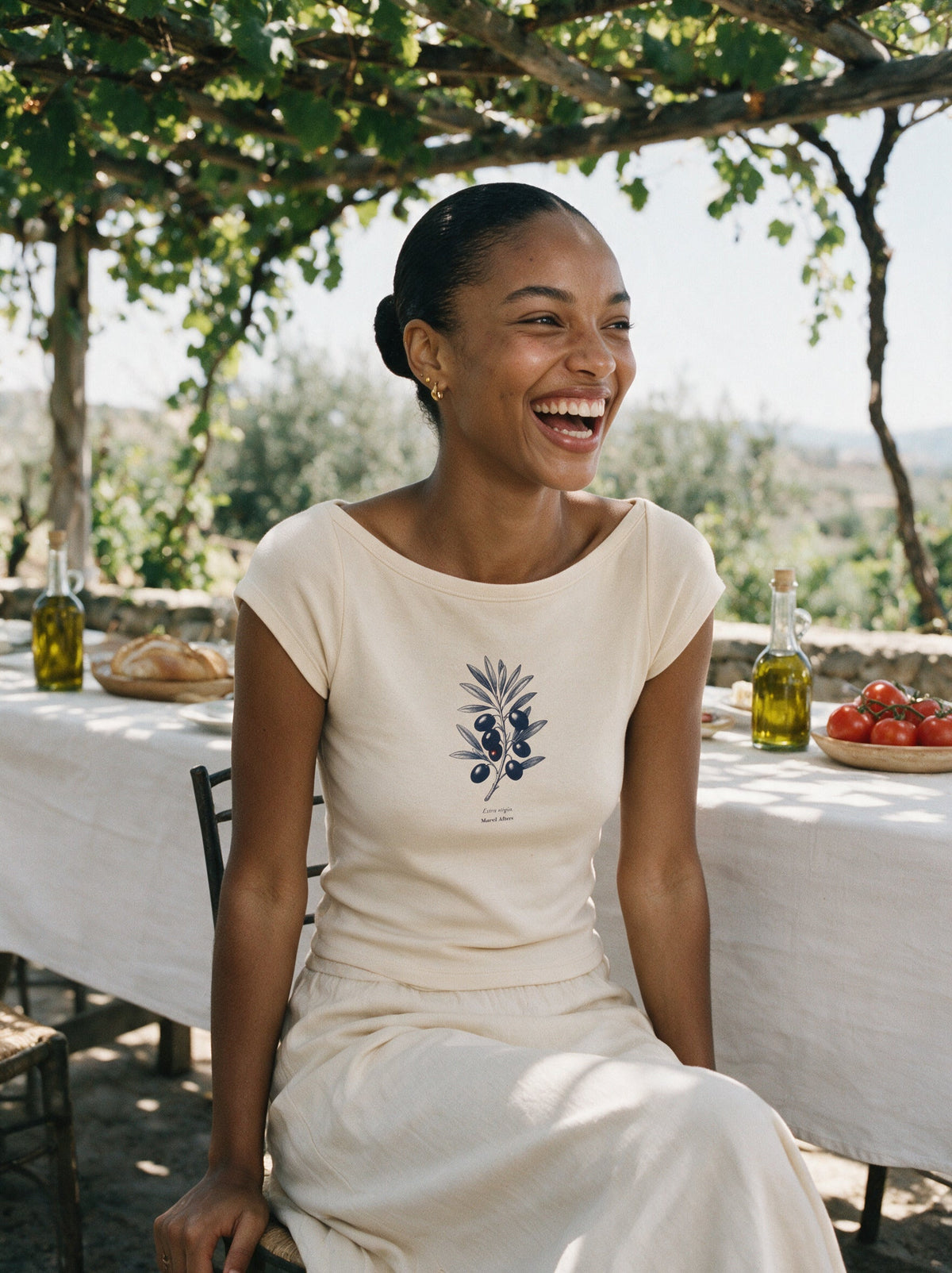 Woman in the Extra Virgin wide-neck baby tee