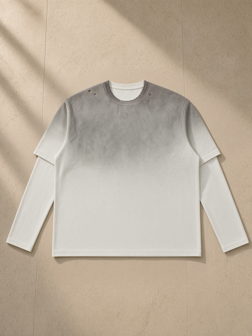 Vintage Wash Layered T-Shirt in White Gray, laid flat on pale limestone