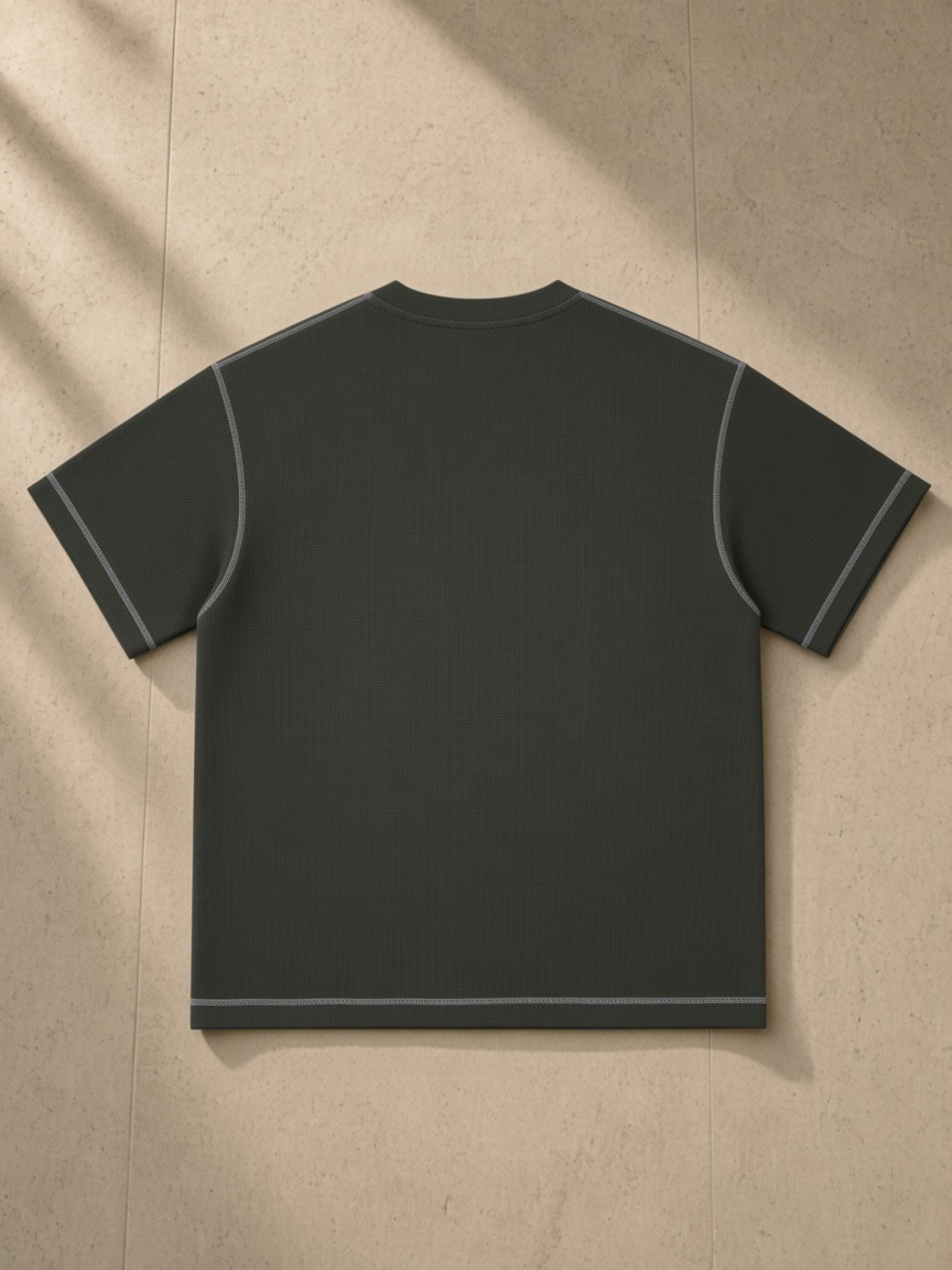 Sunfade Waffle Boxy T-Shirt in Gray Green, laid flat on pale limestone, back.