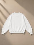 Essential Heavyweight Dolman Sleeve Boxy Sweatshirt in White, laid flat on pale limestone, back view