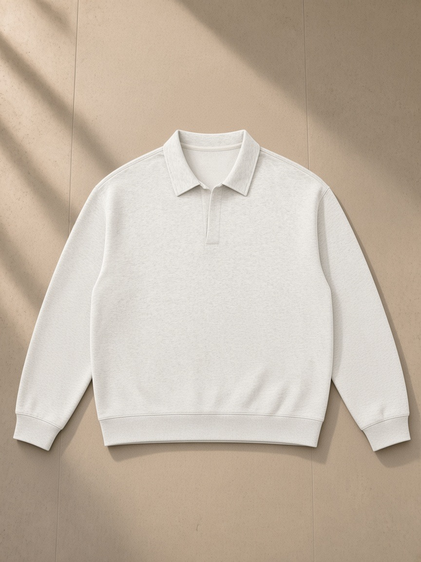 Oversized Collared Sweatshirt in Oat Gray, laid flat on pale limestone