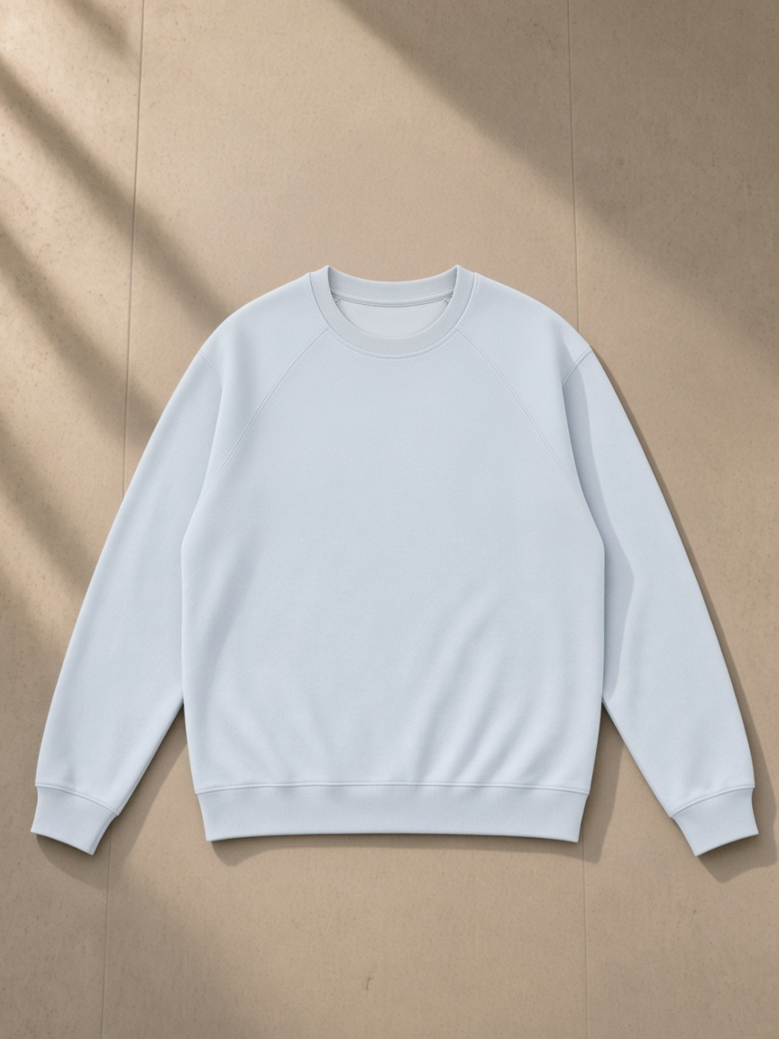 Regular Fit Crewneck Sweatshirt in Light Blue, laid flat on pale limestone, front.