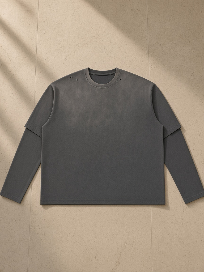 Vintage Wash Layered T-Shirt in Dark Gray, laid flat on pale limestone