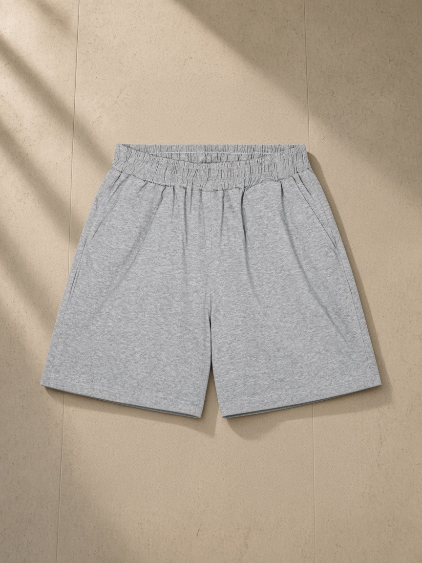 Unisex regular fit shorts in Flower Gray, laid flat on pale limestone