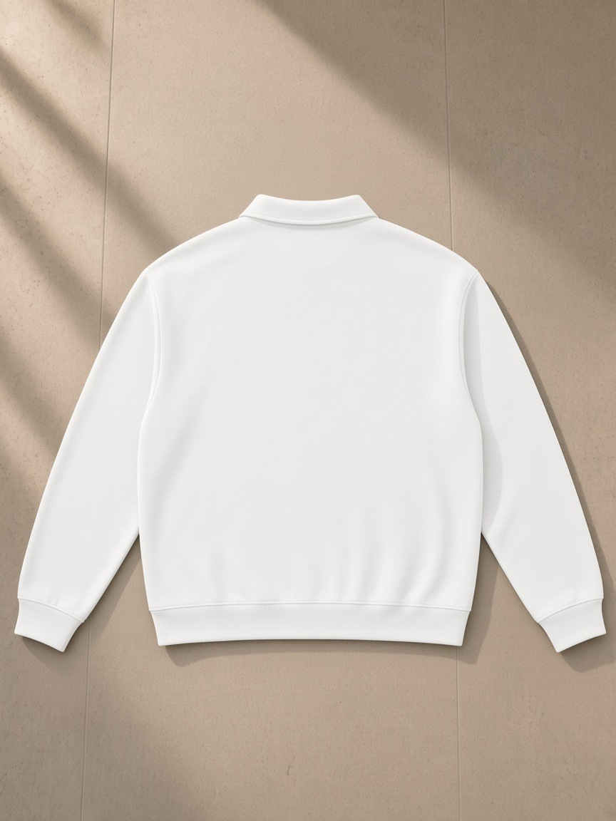 Oversized Collared Sweatshirt in White, laid flat on pale limestone, back view