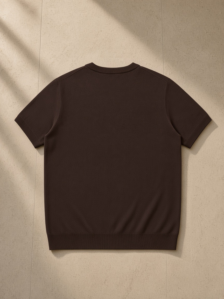 Crewneck Knit T-Shirt in Brown, laid flat on pale limestone, back view
