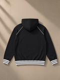 Unisex striped trim zip-up hoodie in Black, back view on white. Marcel Afters