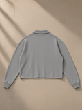 Mineral Wash Pullover Sweatshirt in Medium Gray, laid flat on pale limestone, back view