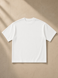 Unisex boxy mesh crewneck t-shirt in White, laid flat on pale limestone