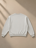 Boxy fleece crewneck sweatshirt in Flower Gray, laid flat on pale limestone, back view
