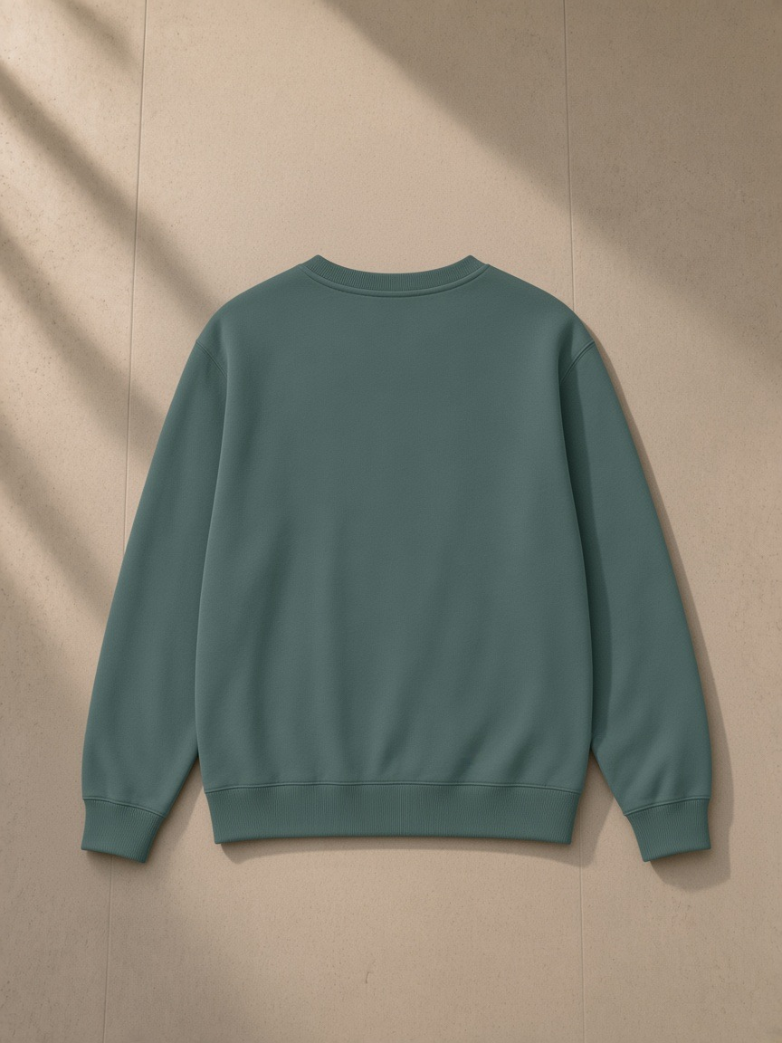 Classic Cotton Sweatshirt in Olive Green, laid flat on pale limestone, back view