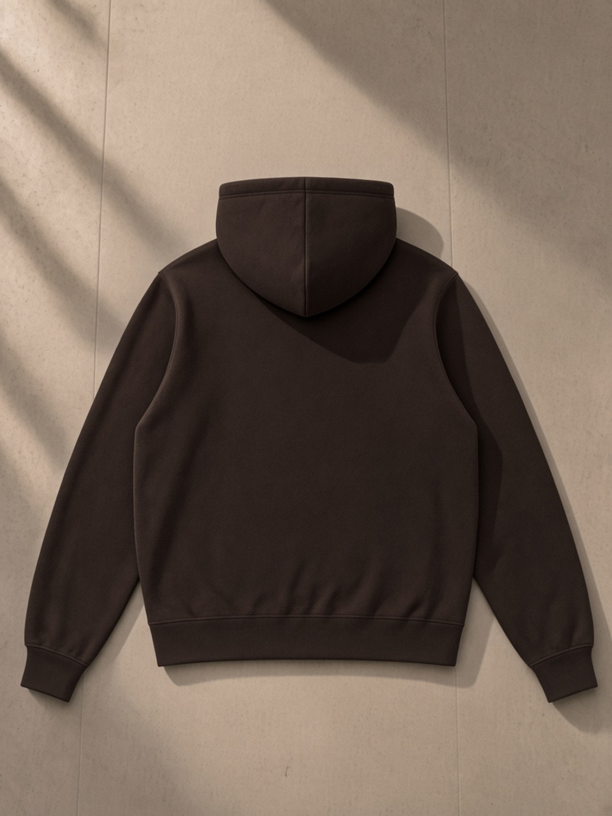 Fleece Full Zip Hoodie in Coffee, laid flat on pale limestone, back.