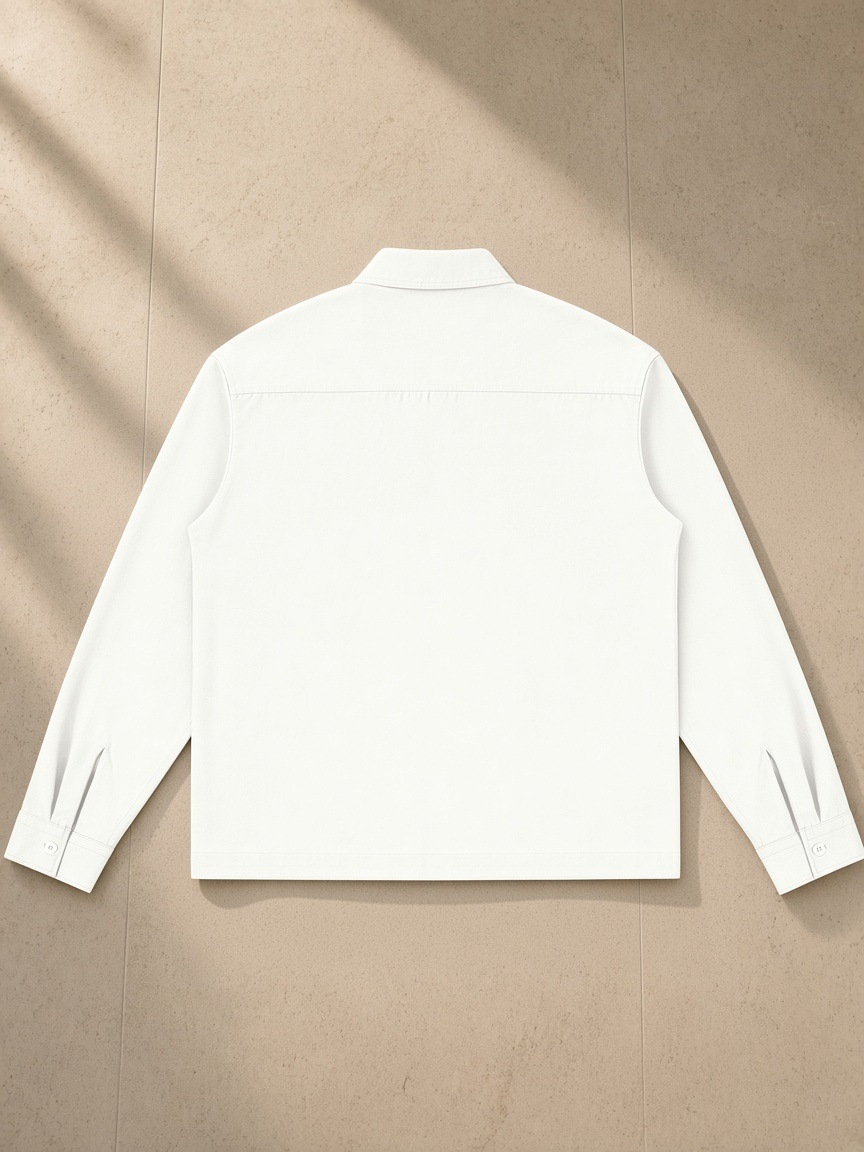 Button-Front Long Sleeve Shirt in White, laid flat on pale limestone, back view