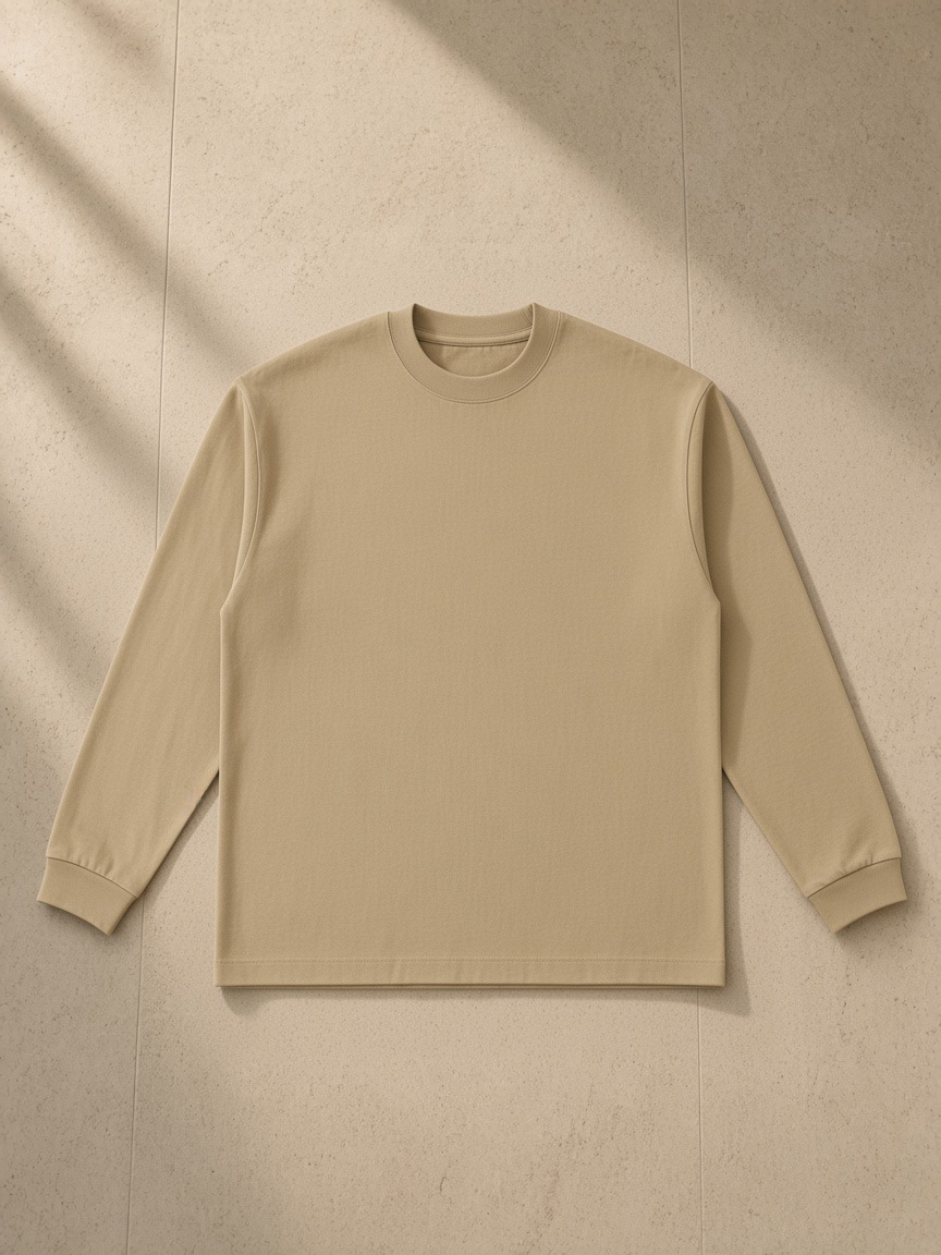 Essential Cotton Long Sleeve T-Shirt in Khaki, laid flat on pale limestone