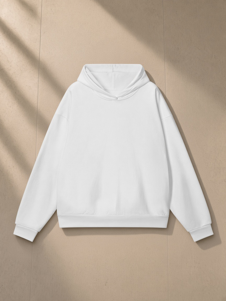 Heavyweight hidden pocket fleece hoodie in Lucent White, laid flat on pale limestone