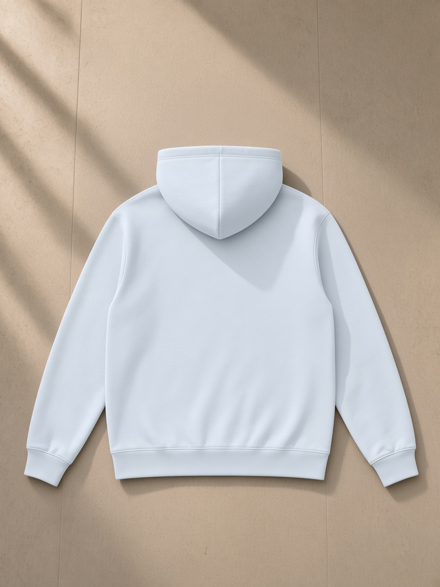 Unisex regular fit full zip hoodie in Light Blue, laid flat on pale limestone, back view