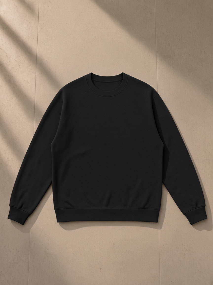 Regular Fit Crewneck Sweatshirt in Black, laid flat on pale limestone, front.