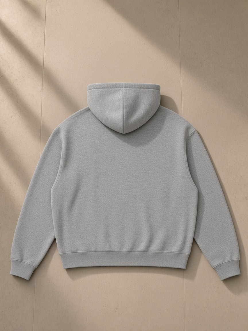 Unisex waffle boxy full zip hoodie in Flower Gray, laid flat on pale limestone, back view