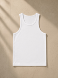 Performance tank top in White, laid flat on pale limestone