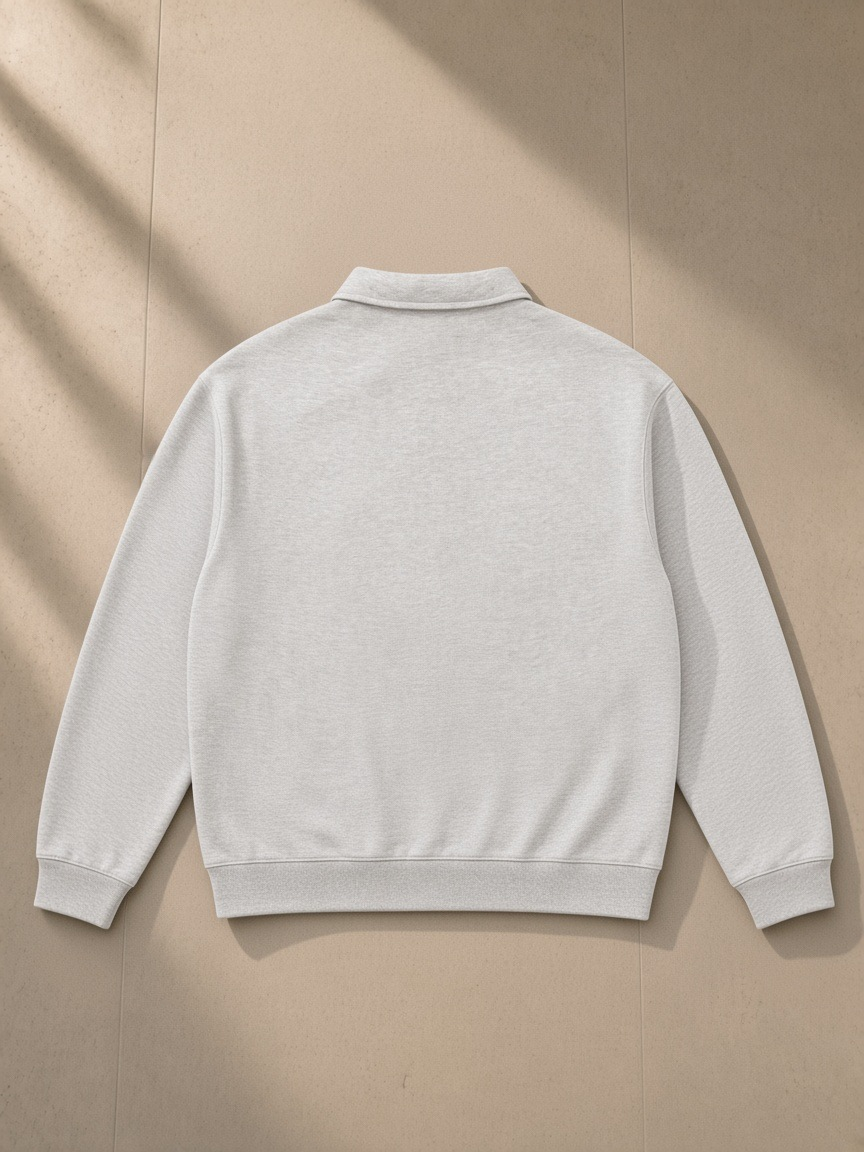Oversized Collared Sweatshirt in Flower Gray, laid flat on pale limestone, back view