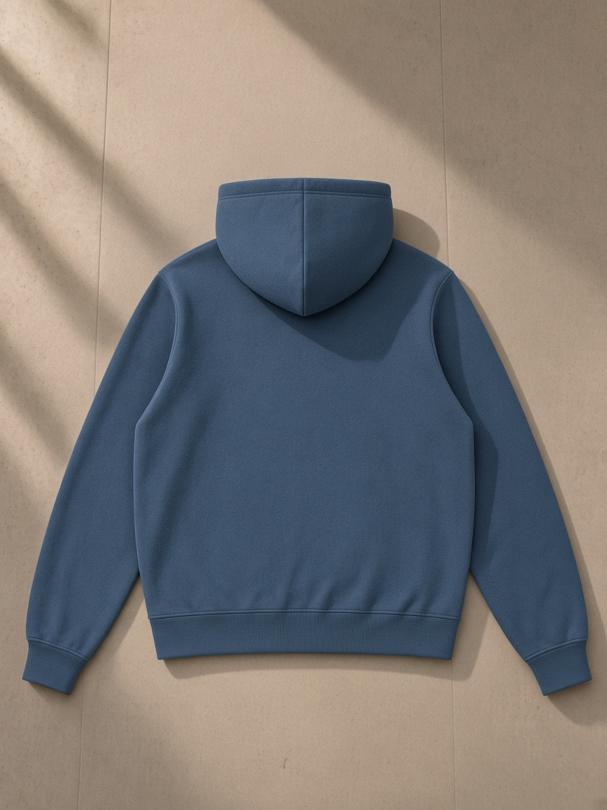 Fleece Full Zip Hoodie in Haze Blue, laid flat on pale limestone, back.
