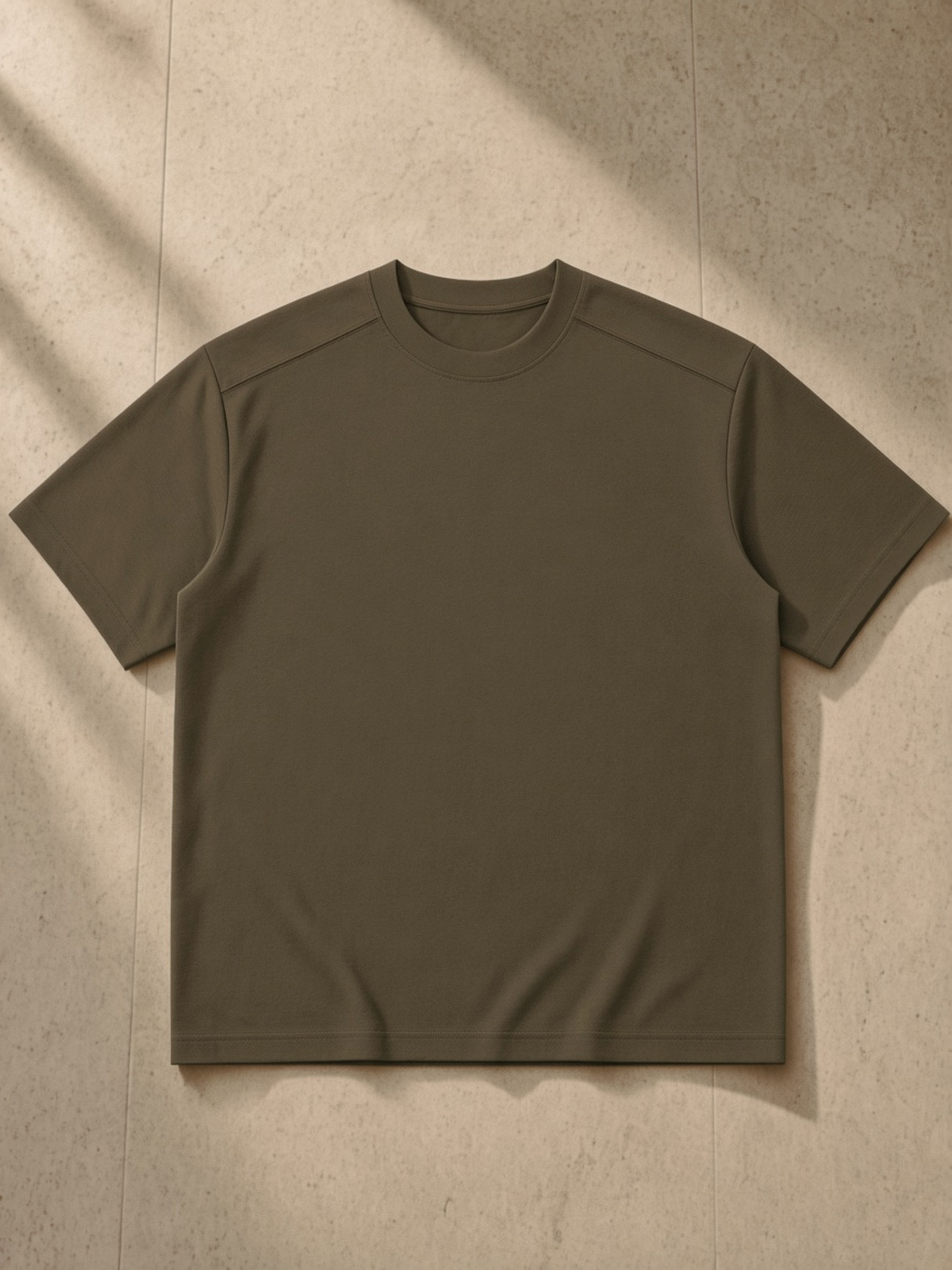 Sorona Quick-Dry Loose Fit Boxy T-Shirt in Coffee, laid flat on pale limestone, front.