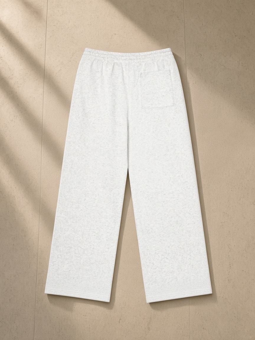 Heavyweight Fleece Sweatpants in Flower Gray, laid flat on pale limestone, back.