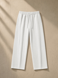 Heavyweight Fleece Sweatpants in Flower Gray, laid flat on pale limestone
