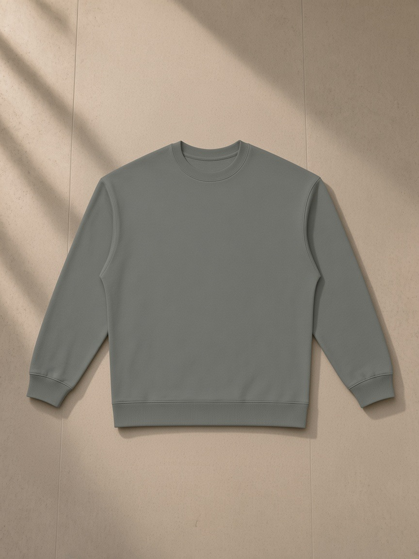 Oversized Crewneck Sweatshirt in Gray, laid flat on pale limestone