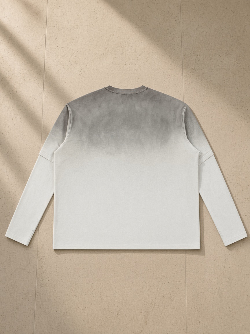 Vintage Wash Layered T-Shirt in White Gray, laid flat on pale limestone, back view