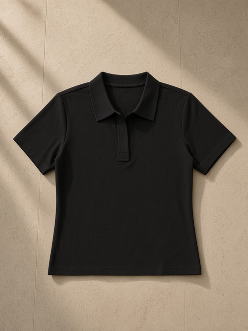 Bodycon Short Sleeve Polo Shirt in Black, laid flat on pale limestone