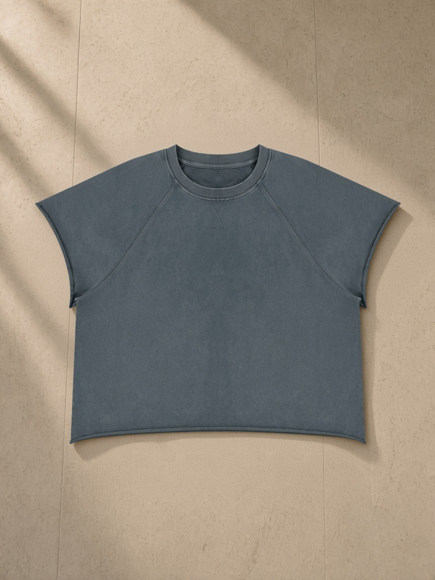 Unisex vintage wash raw edge boxy t-shirt in Gray Blue, front view on white. Marcel Afters
