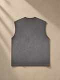 Reverse Washed Tank Top in Gray, laid flat on pale limestone