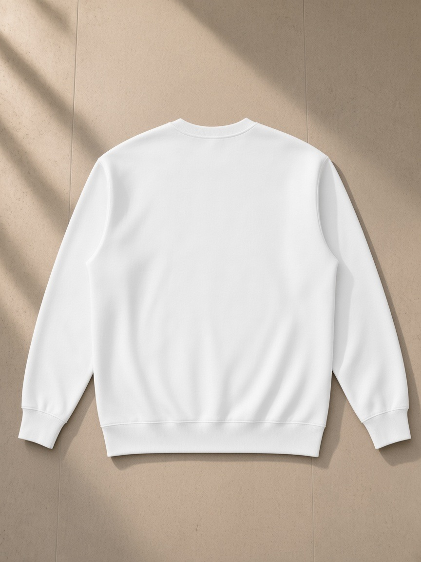 Essential heavyweight crewneck sweatshirt in White, laid flat on pale limestone, back view