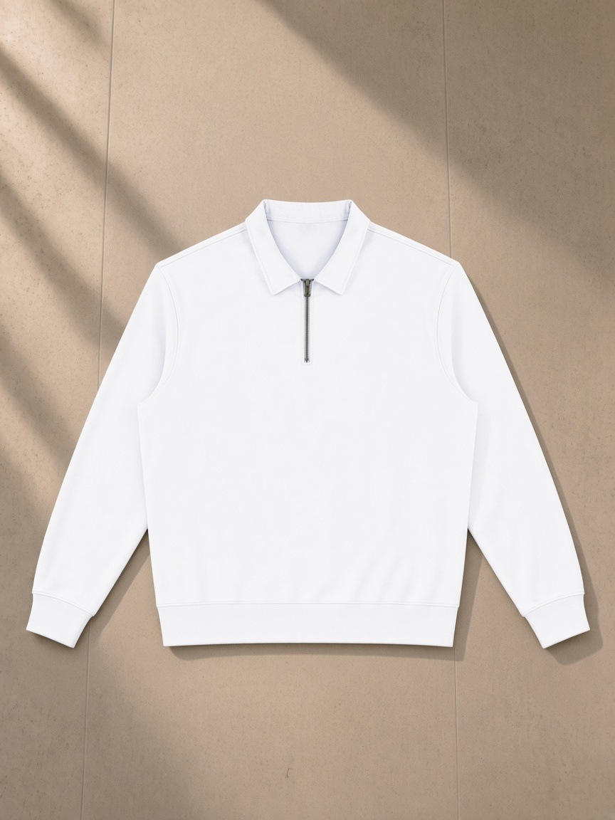 Vintage Wash Quarter-Zip Sweatshirt in White, laid flat on pale limestone, front.