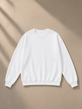 Unisex heavyweight drop shoulder sweatshirt in Lucent White, laid flat on pale limestone