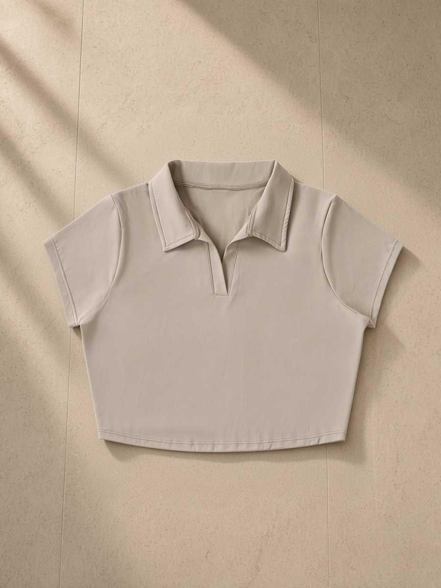 V-Neck Lapel Crop Top in Light Coffee, laid flat on pale limestone