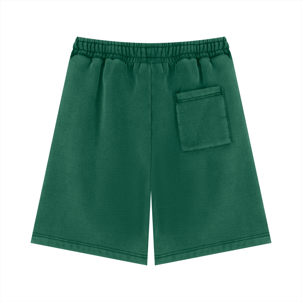 Unisex vintage wash fleece shorts in Dark Green, back view on white. Marcel Afters