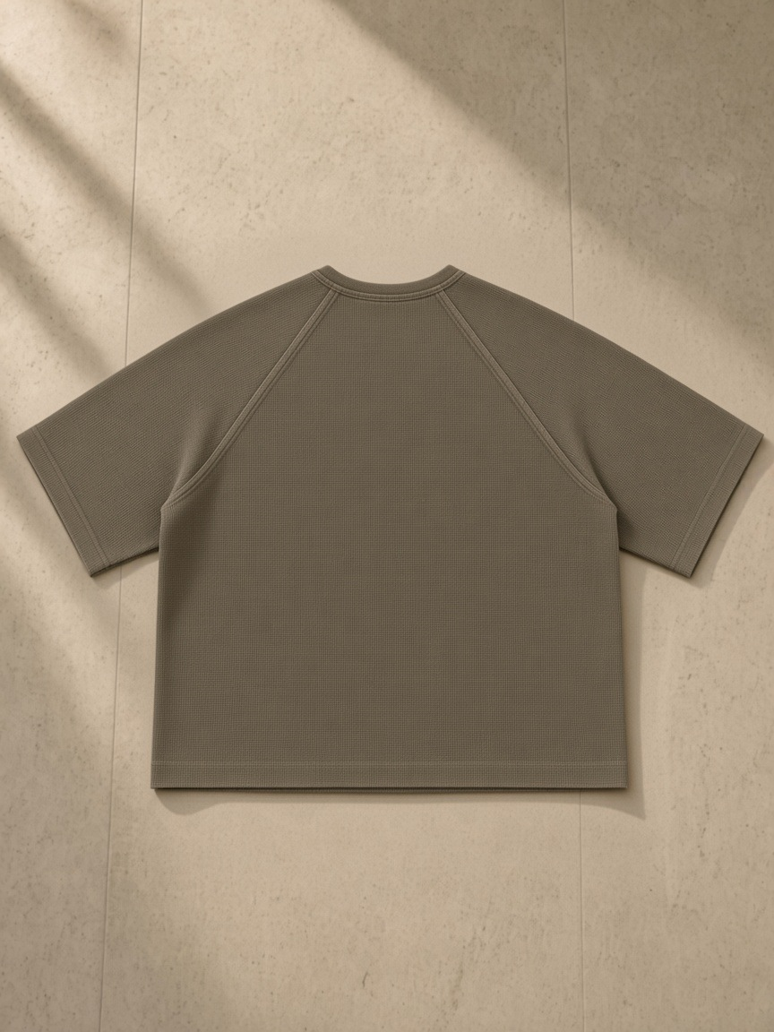 Mineral Wash Boxy Waffle T-Shirt in Coffee, laid flat on pale limestone, back.