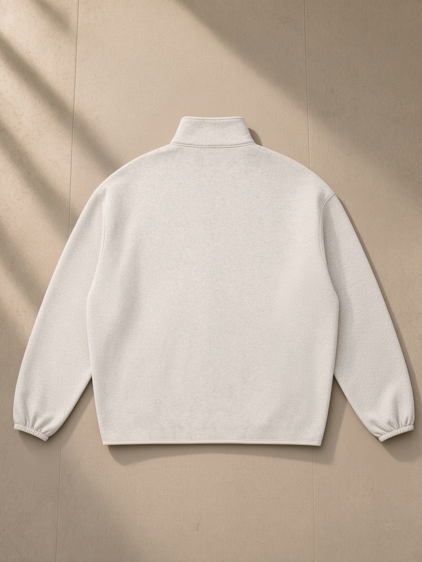 Heavyweight Stand Collar Jacket in Oat Gray, laid flat on pale limestone, back view