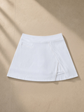 High-Waist Pocketed A-Line Skirt in White, laid flat on pale limestone