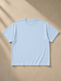 Unisex cotton boxy t-shirt in Sky Blue, front view on white. Marcel Afters