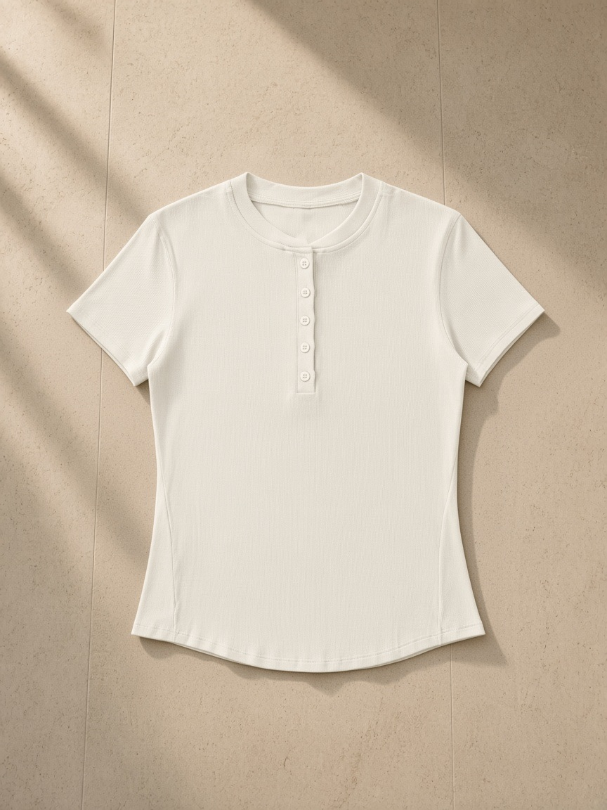 Modal bodycon henley shirt in Ivory White, laid flat on pale limestone