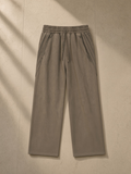 Snow Washed Tape Raw Edge Sweatpants in Khaki, laid flat on pale limestone, front.