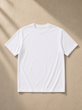 Performance Short Sleeve T-Shirt in White, laid flat on pale limestone