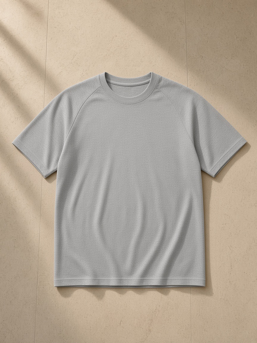 Performance Short Sleeve T-Shirt in Flecking Gray, laid flat on pale limestone