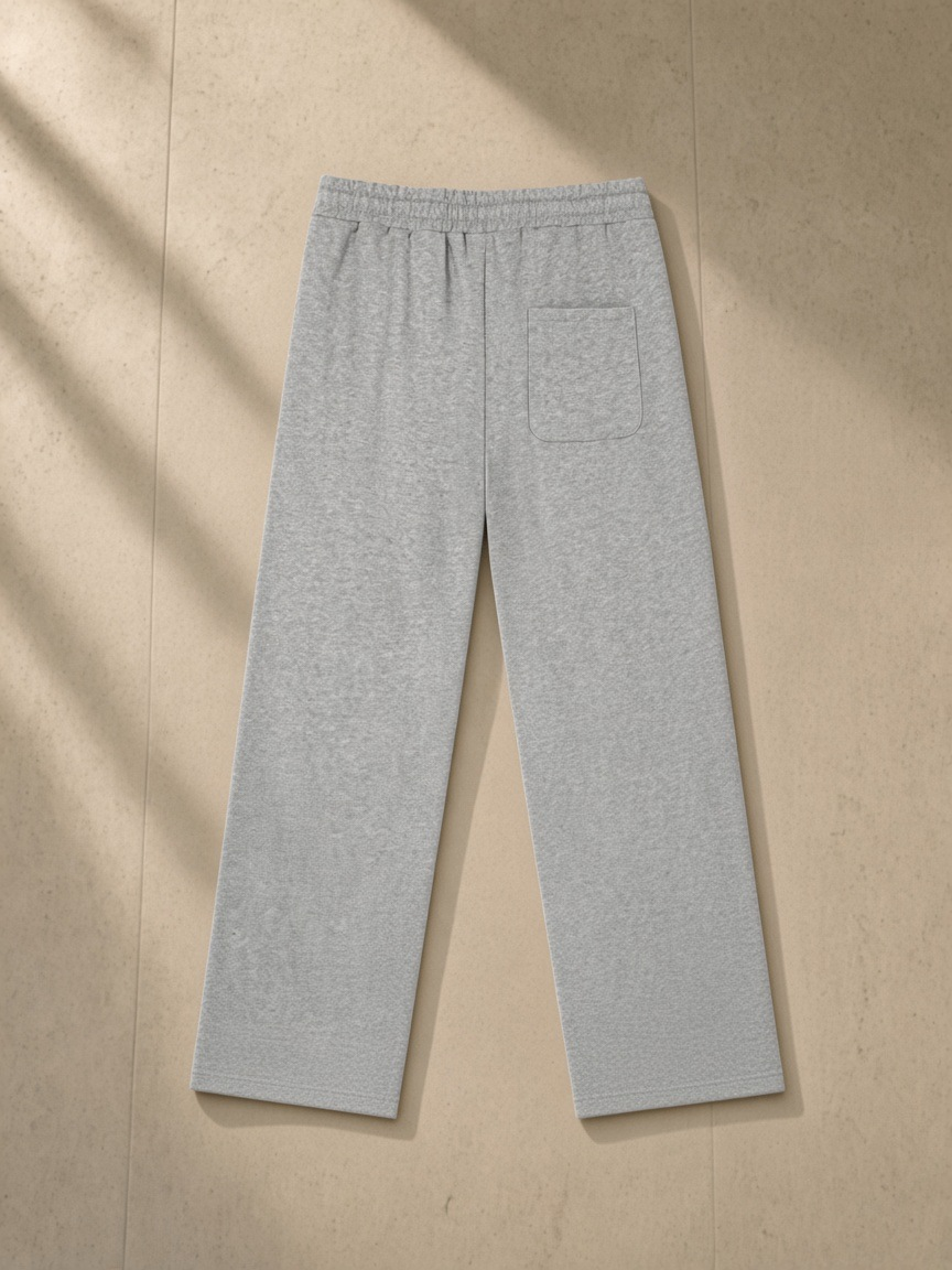 Heavyweight Sweatpants in Flower Gray, laid flat on pale limestone, back.