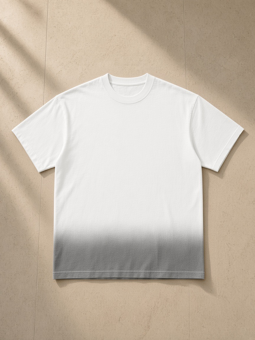 Sunfade Vintage Washed T-Shirt in White, laid flat on pale limestone