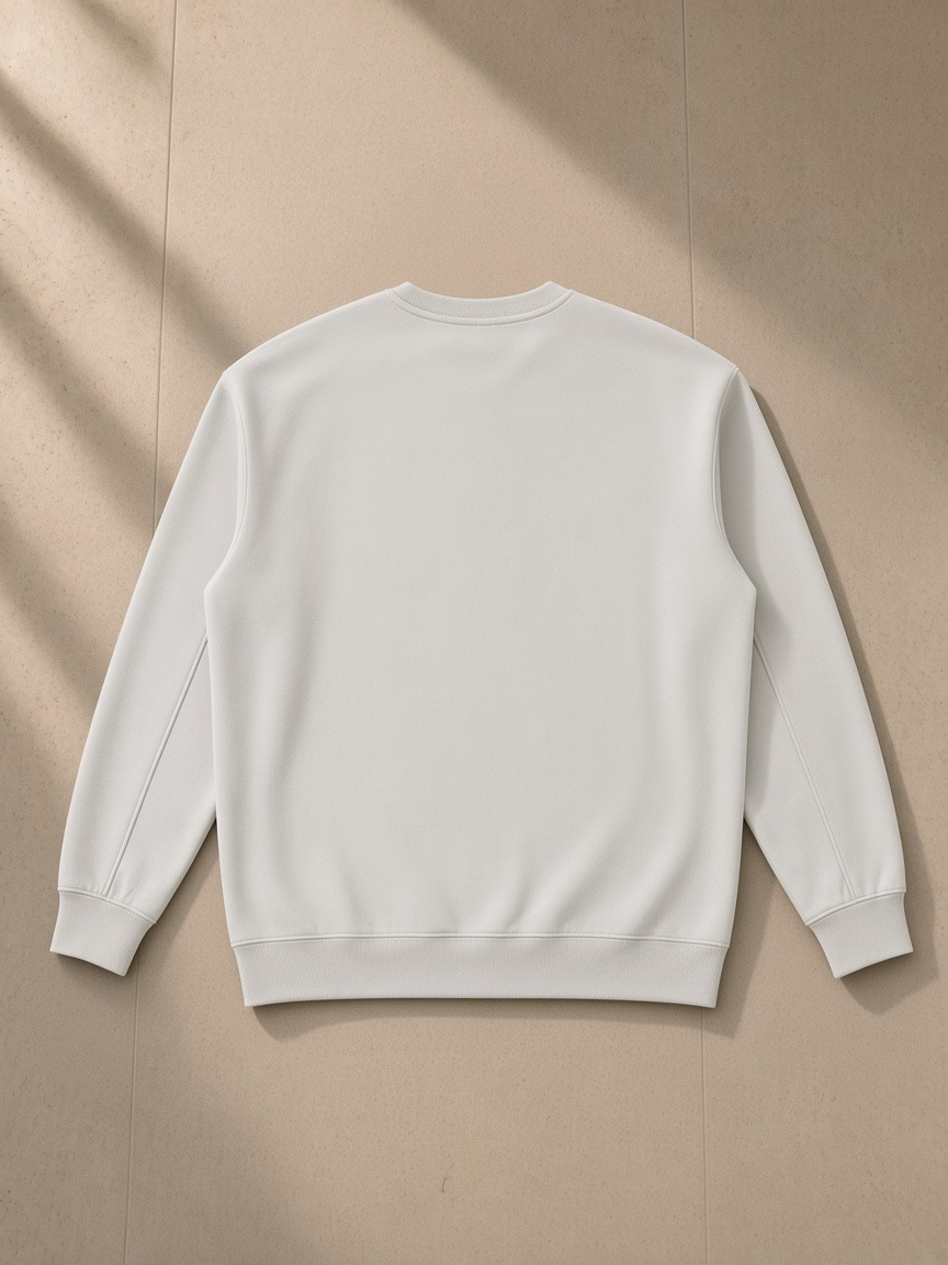 Essential heavyweight crewneck sweatshirt in Gray, laid flat on pale limestone, back view